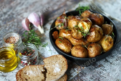 Preview: Selective Focus. Cast-Iron Skillet With Baked Potatoes In A Peel. Fragrant Baked Potato. Spices And