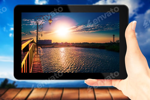 Preview: Tablet Computer Isolated In A Hand On The Nature Backgrounds