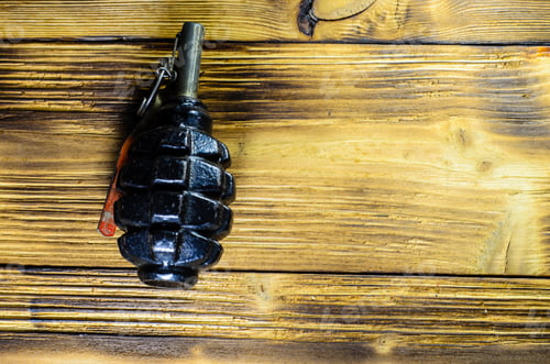 Preview: Black Hand Grenade On The Wooden Table