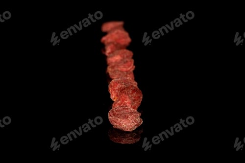 Preview: Lot Of Whole Dried Red Goji Row Isolated On Black Glass