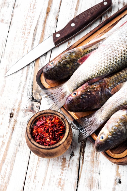 Preview: Fresh Raw Fish On Wooden Cutting Board.Healthy Eating Concept