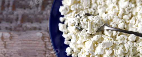 Preview: Selective Focus. Macro. Organic Cottage Cheese In A Blue Plate. Fresh Grained Cottage Cheese