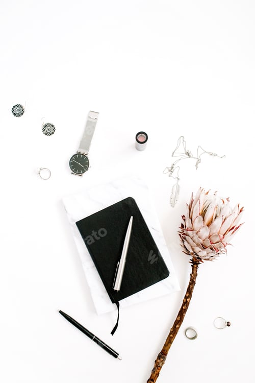 Preview: Blogger Or Freelancer Workspace With Protea Flower, Notebook And Feminine Accessories On White