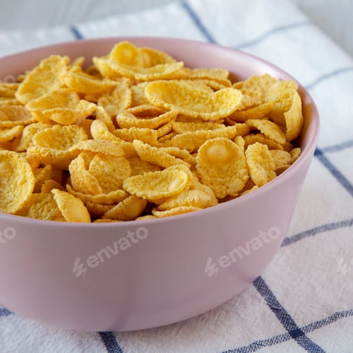 Preview: Corn Flakes In A Pink Bowl For Breakfast, Side View. Closeup.