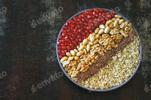 Preview: Breakfast Bowl Of Oatmeal With Nuts And Pomegranate. Healthy Breakfast. Colorful Healthy Food In