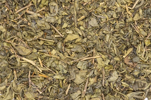 Preview: Lot Of Pieces Of Dry Green Tea Closeup Flatlay Isolated