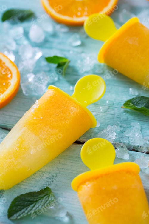 Preview: Home Made Orange Popsicles On Turquoise Wooden Surface