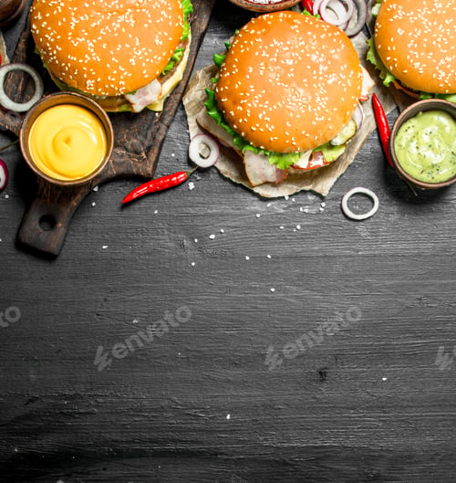Preview: Fast Food. Various Burgers With Sauces. On The Black Chalkboard.