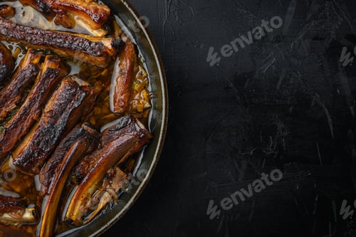 Preview: Barbecue Pork Spare Ribs Set, In Frying Cast Iron Pan, On Black Stone Background, Top View Flat
