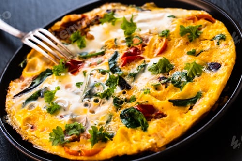 Preview: Breakfast - Omelette With Vegetables On Black Stone Background