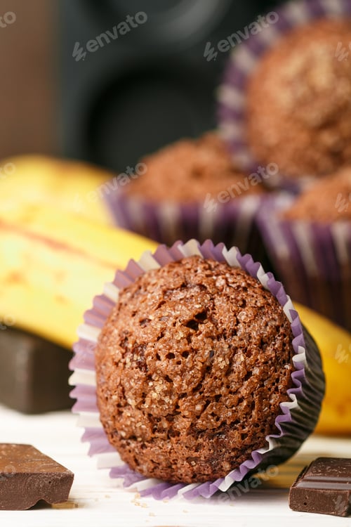 Preview: Chocolate Muffins With Banana And Sugar Crust Close-Up. Fresh Homemade Pastry. Selective Focus
