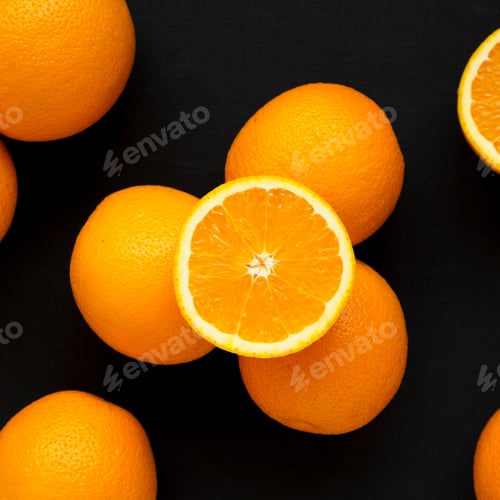 Preview: Fresh Ripe Organic Oranges On A Black Surface, Top View. Flat Lay, Overhead, From Above.