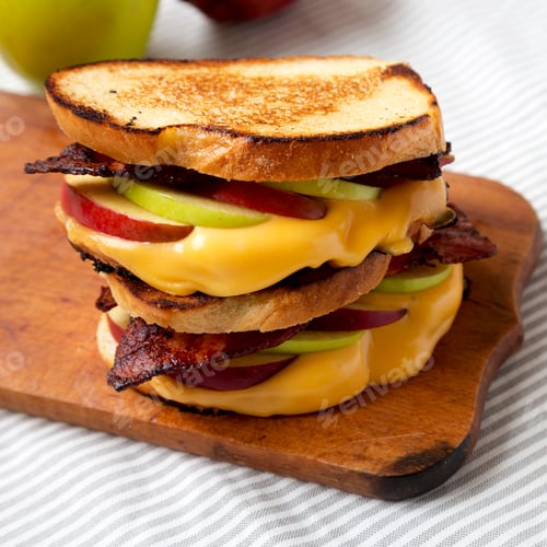 Preview: Homemade Bacon Apple Grilled Cheese On A Rustic Wooden Board, Side View. Close-Up.