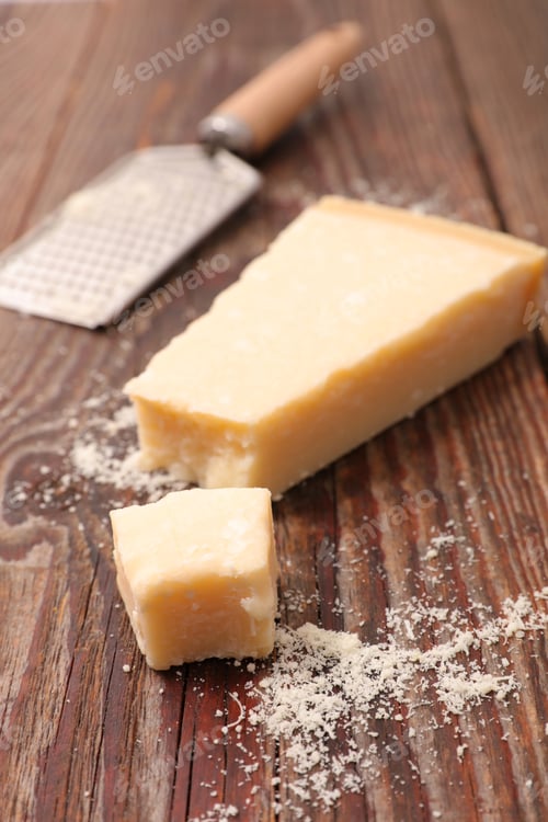 Preview: Parmesan Cheese Portion On Wood Background