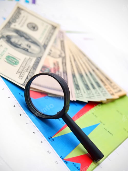 Preview: Magnifier And Dollars On Graphs.