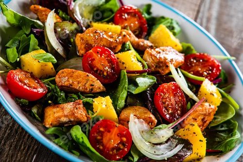 Preview: Salad With Chicken, Mango And Tomatoes On Wooden Table