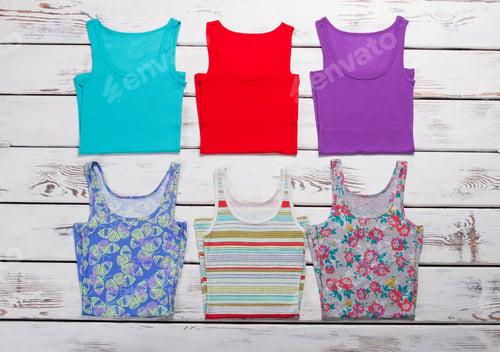 Preview: Collection Of Colorful T-Shirts On Wooden Background. Woman'S Summer Clothes.