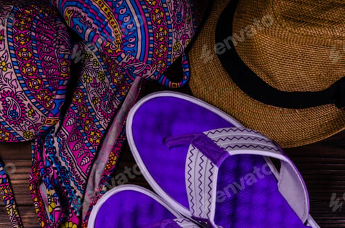 Preview: Swim Suit, Hat And Flip Flops On Wooden Table. Top View. Summer Vacation Concept