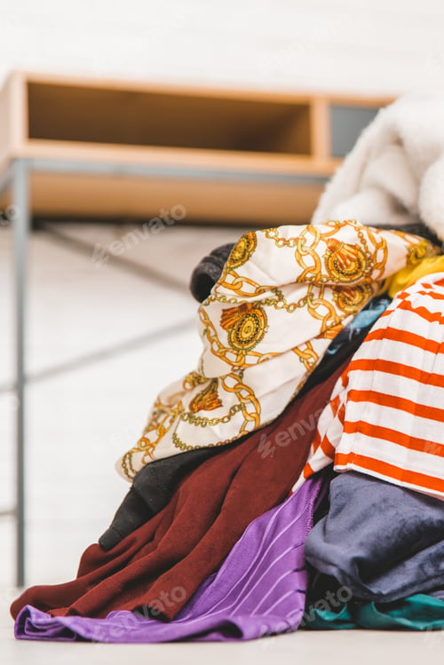Preview: Pile Of Unfolded Clothes For Laundry On The Floor. Heap Of Used Clothes For Donation And Recycling