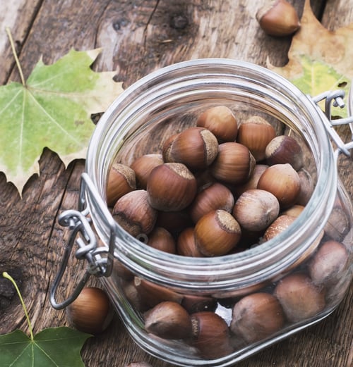 Preview: Fruits Nutmeg, In Glass Container On The Wooden Table,Spangled Leaves