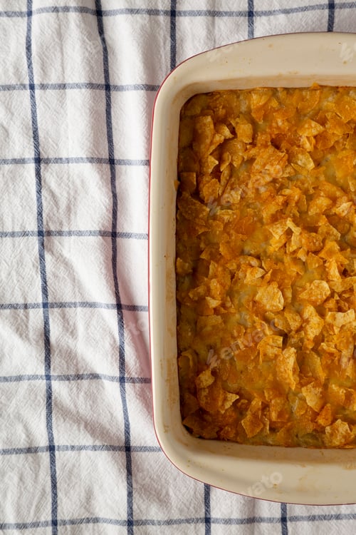 Preview: Overhead View, Homemade Funeral Potatoes Casserole In A Dish. Flat Lay, Top View, From Above. Copy