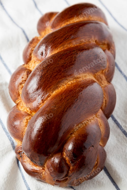 Preview: Homemade Jewish Challah Bread On Cloth, Side View. Closeup.