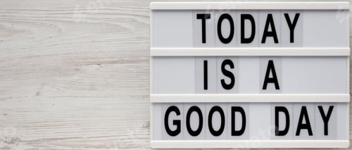 Preview: 'Today Is A Good Day' Words On A Lightbox On A White Wooden Surface, Top View. Overhead, From