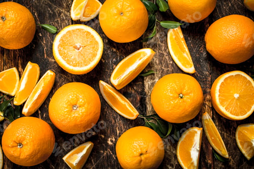 Preview: Fresh Oranges With Leaves. On A Wooden Background.