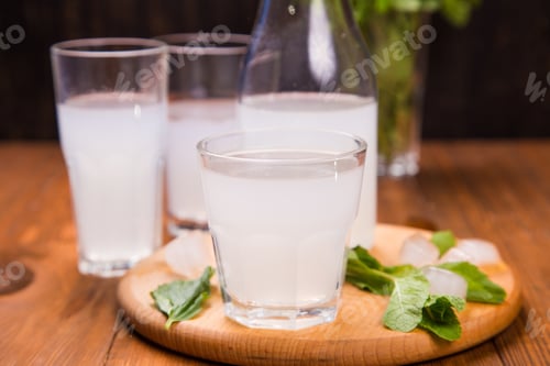 Preview: Fresh Soda Drink With Ice And Mint On Wooden Background