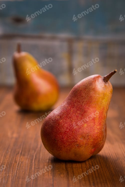 Preview: Two Delicious Raw Ripe Pears On Wooden Background