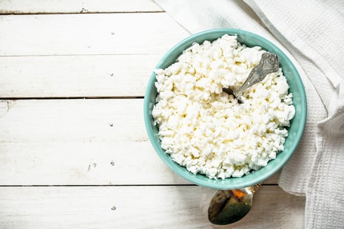 Preview: Cottage Cheese From Fresh Milk In A Bowl. On A White Wooden Table.