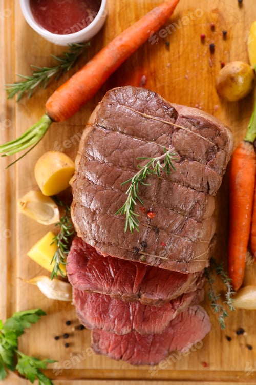 Preview: Roast Beef And Slices On Wooden Board