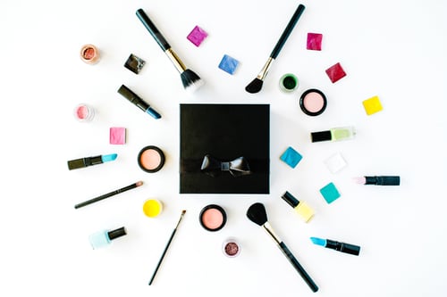 Preview: Flat Lay Female Cosmetics Collage Box With Lipstick, Brush On White Background. Top View Set