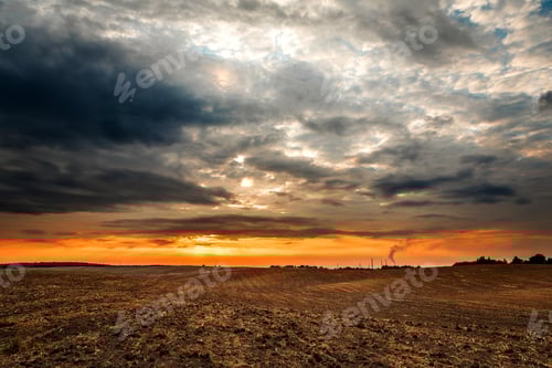 Preview: Wheat Field After Harvest With Straw Bales At Sunset