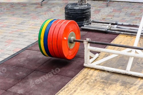 Preview: Heavy Barbell On Platform In Street Gym