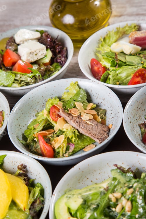 Preview: Some Fresh Salad With Many Ingredients, Mixed In Grey Dish