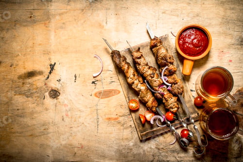 Preview: Beer With Pork Shish Kebab And Tomatoes. On A Wooden Table.