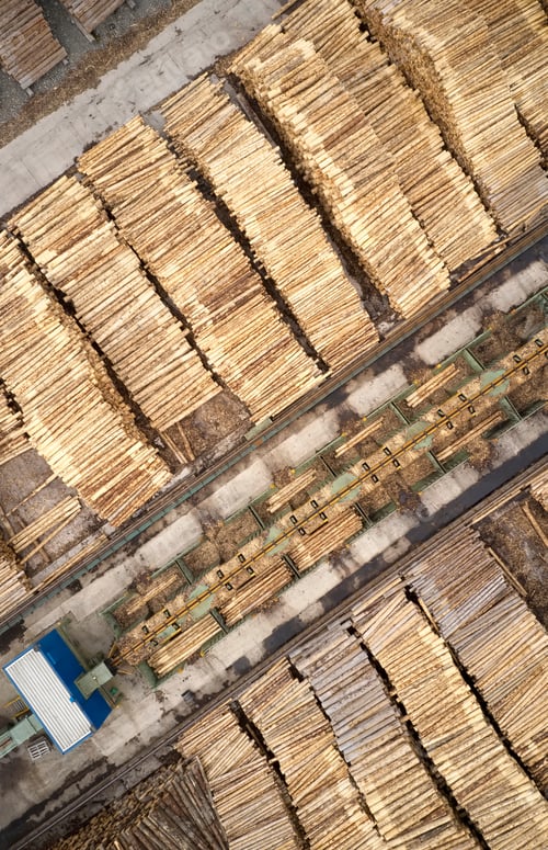 Preview: Sawmill Aerial View Chopped Tree Wood Logs Stacks In A Row With Machinery