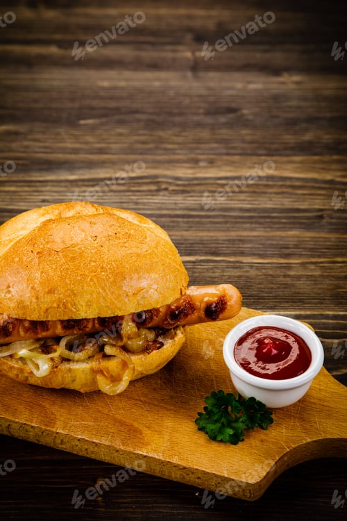 Preview: Bun With Sausage On Cutting Board