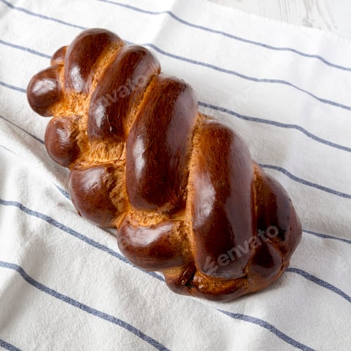 Preview: Homemade Jewish Challah Bread On Cloth, Side View. Closeup.