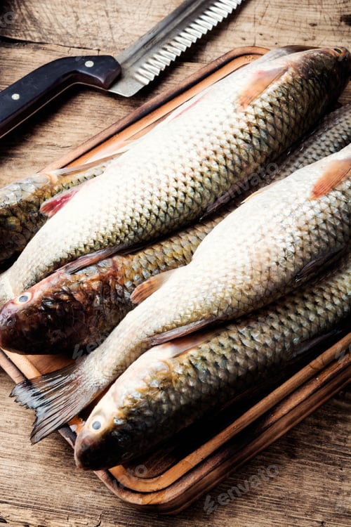 Preview: Fresh Raw Fish And Food Ingredients On Wooden Table