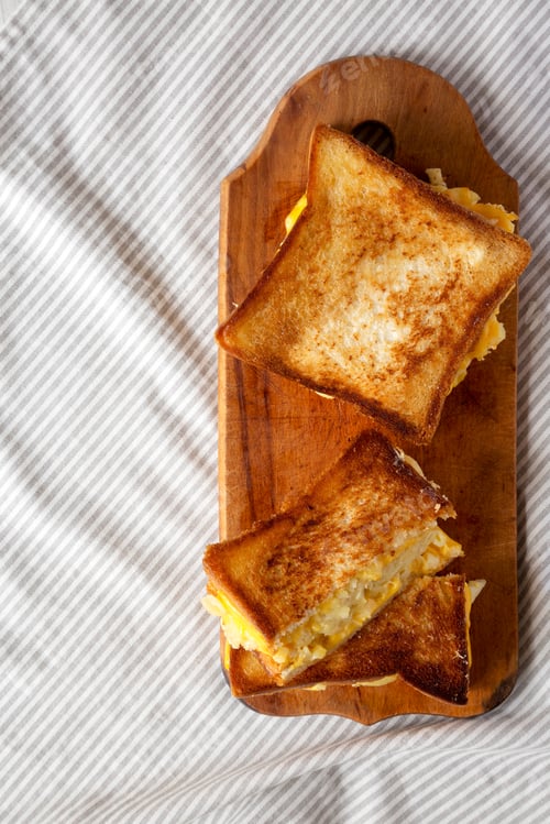Preview: Homemade Grilled Macaroni And Cheese Sandwich On A Rustic Wooden Board, Top View. Flat Lay