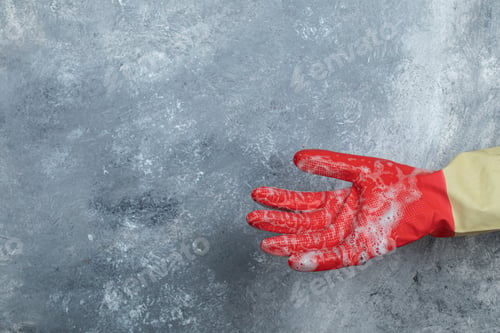 Preview: Hand In Protective Gloves On Marble Background