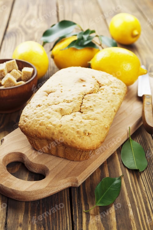 Preview: Lemon Cake And Cane Sugar On The Wooden Table