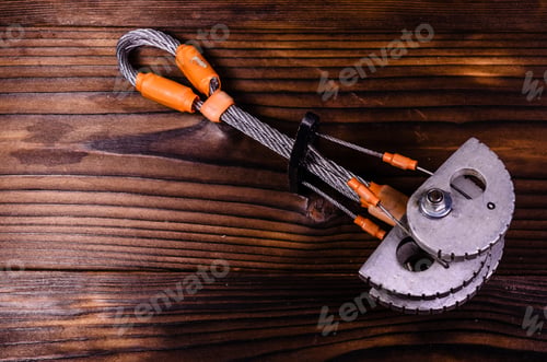 Preview: Camming Device Friend For Rock Climbing On Rustic Wooden Table. Top View