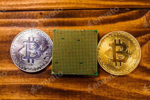 Preview: Bitcoins And Microprocessor On Rustic Wooden Table. Top View