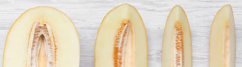 Preview: Melon Slices On White Wooden Table, Top View. From Above, Flat Lay. Close-Up.