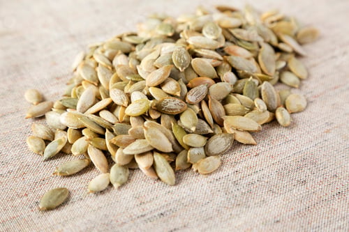 Preview: Roasted Pumpkin Seeds On Cloth, Side View. Close-Up.