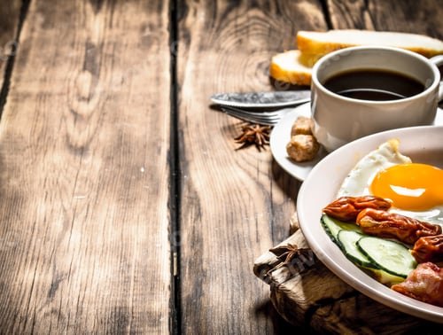 Preview: Fresh Breakfast. Cup Of Coffee , Fried Bacon With Eggs And Smoked Sausage. On Wooden Background.