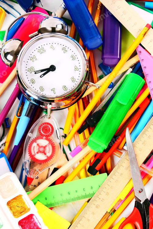 Preview: Stationery And Alarm Clock. A Bright Background.